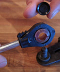 Close-up of Universal Automatic Transmission Shift Cable Bushing Repair Kit Replacement Shifter Bushing being installed.