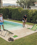 Four men playing Backyard Golf Cornhole Game For Adults And Men, A Dope Chipping Practice Session That Feels Like Real Golf by a pool
