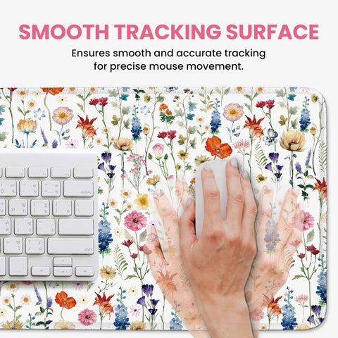 Close-up of Ultra Large Desk Pad For Desktop 31.5 Inch By 11.8 Inch Extended Mouse Pad With Anti Slip Surface Featuring Wildflowers with a hand using a mouse.