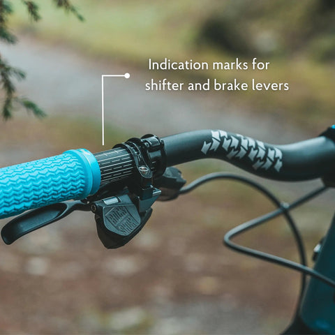 Close-up of Upturn High Rise Mountain Bike Handlebar with 31.8mm clamp and indication marks, showing shifter and brake levers.
