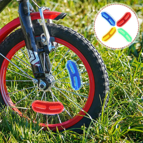20 Pack Bike Wheel Reflectors For Spokes, Compact Replaceable Reflective Signs, Lightweight Bicycle Safety Gear For Night Riding, Stay Seen With High Visibility 2.59 X 1.02 X 0.19 Inches attached to red bicycle wheel.