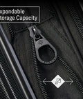 Close-up of black Samsonite Omni 2 luggage zipper with expandable storage capacity indicator