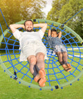 Man and child relaxing on 60 Inch Spider Web Saucer Tree Swing for Kids and Adults Heavy Duty Outdoor Net Swing With Steel Frame