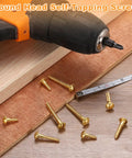Rock Solid Copper Wood Screws M5 X 20Mm Slotted Round Head Self Tapping Fasteners Built Tough For Heavy Duty DIY Woodworking Jobs And Quick Home Fixes 20 Piece Pack with drill and wooden surface.