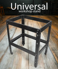 Front view of a universal workshop stand made of black steel with adjustable legs, resembling a Beefed Up Heavy Duty Router Table Stand For Workshop.