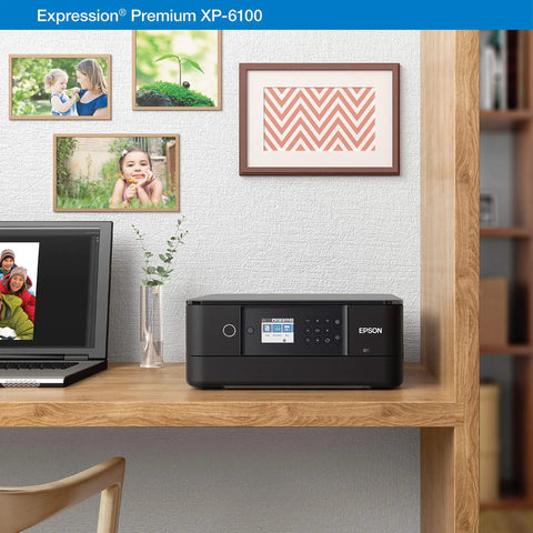 Slick Wireless Color All In One Inkjet Printer Featuring Killer Five Color Photo System For Crisp Documents And Legit Eight By Ten Prints Perfect For Your Home Office Setup Or Creative Project Workflow on a wooden desk with photos and laptop.