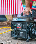 Person using Gas Powered Portable Generator With Carrying Handle 1200W Running Power And 1200 Peak Watts Black And Gray outdoors