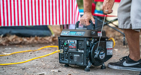 Person using Gas Powered Portable Generator With Carrying Handle 1200W Running Power And 1200 Peak Watts Black And Gray outdoors