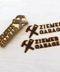 Branding Iron Kit For Wood And Leather Projects, Pro Grade Personalized Copper Heat Stamp showing "Ziemer Garage" marks on wood