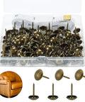 Bronze Upholstery Tacks 100 Pack Decorative Nail Heads For Furniture, Antique Brass Finish, with open box and measuring tape.