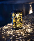 Outdoor Solar Lanterns For Garden Decor, hanging metal design with sun moon star lights on stone patio at night