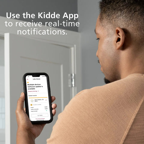 Person using Kidde app for real-time alerts on 4 Pack WiFi Water Leak Detector And Freeze Alarm For Home, Alexa Compatible.