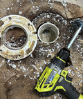 Four Piece PVC Pipe Reamer Set With Socket Saver Heads, showing 1/2 In drill with reamer in a PVC hub for repairs