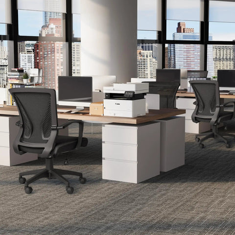 An office setting with ergonomic mesh office chair with dual lumbar support, mid back, swivel desk chair with armrests, black finish