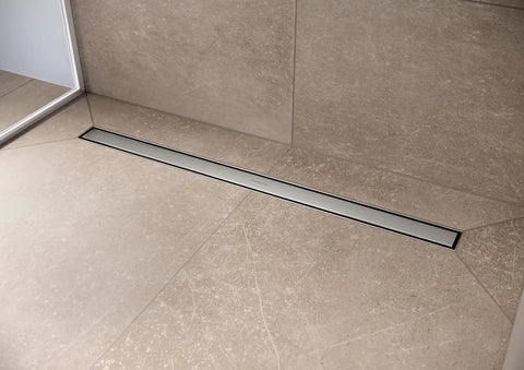 Professional Grade Rectangular Linear Shower Drain With Adjustable Height Frame And Brushed Stainless Steel Cover Tileable Bathroom Floor Grate For Zero Fuss 39 Inch Rough Install mounted in a modern bathroom floor.