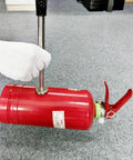 Retractable Magnetic Pickup Tool With 35 Lb Pull Telescoping Extension lifting metal object on floor