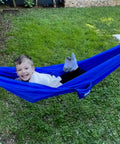 Child playing in Kid Friendly Camping Hammock For Indoors And Outdoors, Ultra Comfy Hangout Hammock For Kids in garden