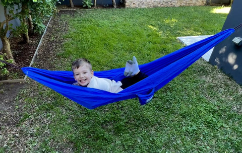 Child playing in Kid Friendly Camping Hammock For Indoors And Outdoors, Ultra Comfy Hangout Hammock For Kids in garden