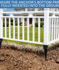 4x4 Fence Post Ground Spike Anchor Pack securing white fence with black powder coated finish, showing installation depth in ground.