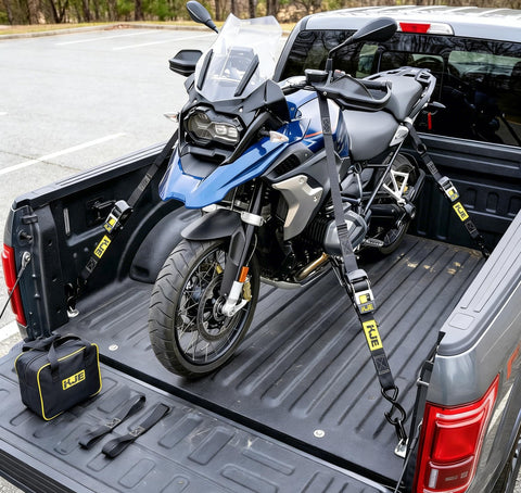 Retractable Ratchet Straps 4 Pack 2 Inch By 10 Foot Heavy Duty Tie Downs securing motorcycle in truck bed