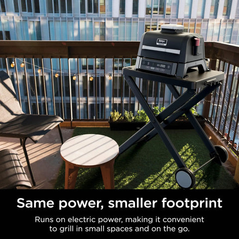 Woodfire Outdoor Grill And Smoker With Four In One Functionality For Real Woodfire Flavor And Sear Crave Ready Backyard Grilling Bake And Roast All In One Electric Heat OG301 on balcony