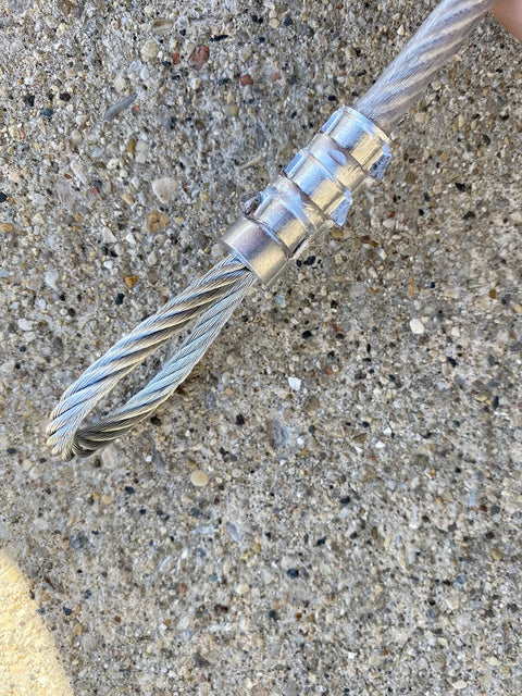 Close-up of crimped wire rope with aluminum ferrule secured using 18 Inch Swaging Tool For Securing Ferrules And Stops On One Sixteenth Inch.