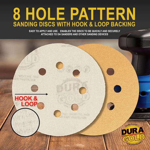 Variety Pack 5 Inch Gold Sanding Discs With 8 Hole Dustless Hook And Loop Backing on a table