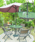 2 Inch Patio Table Umbrella Hole Ring Plug And Cap Set in use on outdoor glass table with parasol, black fitting visible