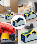 Blue Grey Premium Multi Roll Steel Desk Top Tape Dispenser Holds Three One Inch Tapes Or A Single Three Inch Wide Roll With A Three Inch Core And Up To Five Inch Outer Diameter Built Like A Tank For Your Busy Office on a desk with stationery.
