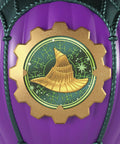 Close-up of purple balloon with a golden witch hat emblem from Unbox Wicked Ozian Balloons Reveal Toy Set With Surprise Mini Doll Inside Each Balloon Openable Balloons With Hot Air Basket And Accessory For Kids Creative Play And Collectible Fun Styles May Vary.