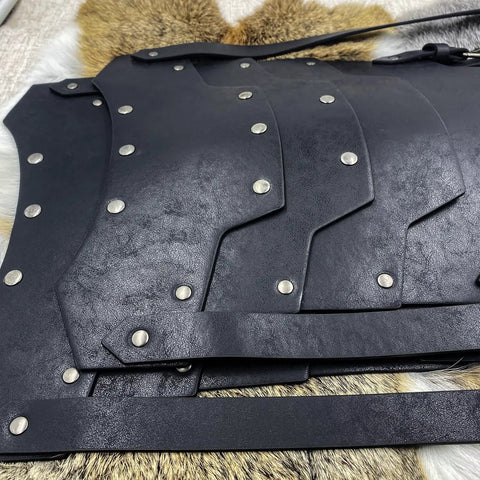 Close-up of Medieval Faux Leather Double Pauldron Shoulder Armor for LARP, black layered faux leather with rivet details
