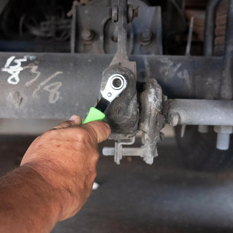Technician using Slack Adjuster Tool And Wrench For Semi Trucks With Angled Head For Easy Air Brake And Drum Brake Adjustments