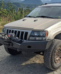 Flipster V3 Winch Plate Mounting System For 4x4s Featuring Hawse Roller And Recessed Fairlead Compatibility Stainless Hardware High Torque Hinge UV Rated Powder Coat Finish Built To Take On Tough Trails Fits Standard 10 Inch Winch Fairleads on a Jeep front bumper