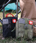 Front view of two compact tactical trauma pouches (black and olive) with US flag and red cross patches.