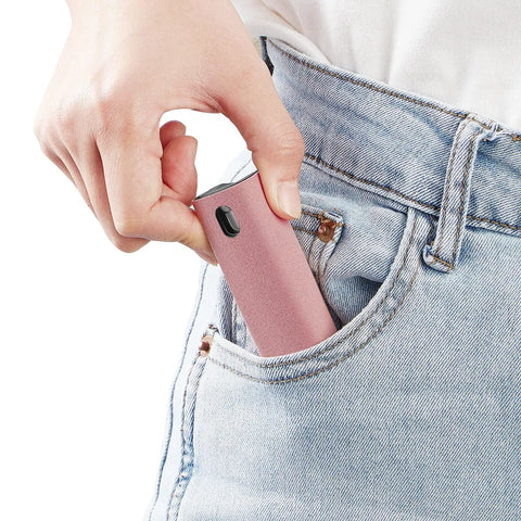 Touchscreen Mist Cleaner Kit With Spray And Wipe Pink Pocket Size Screen Cleaner shown being placed in jeans pocket.