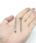 Top Shelf Metal Sliding Nails For Serious Woodworking And Furniture Assembly Solid Silver Hardware Fasteners displayed in a hand.