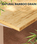 Close-up of natural bamboo grain on the Adjustable Height Solid Bamboo Standing Desk 60 By 30 Inches With Sturdy Black Steel Frame.