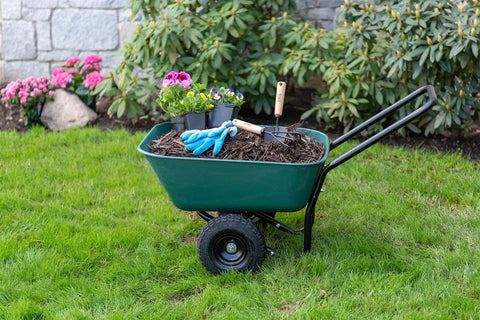 Two Wheel Garden Barrow With Rust Proof Powder Coated Frame Black Loop Handle Cart filled with garden tools and plants on grass