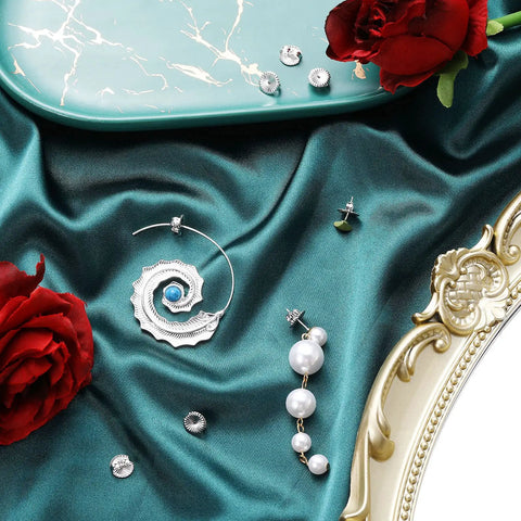 Jumbo Earring Backs For Heavy Studs And Droopy Posts Replacement Secure Lifters 9mm Silver 8 Pack on teal fabric with roses