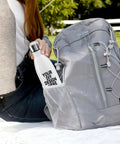 Custom Personalized 17 Oz Stainless Steel Water Bottle with Solid Double Wall Vacuum Insulation in gray backpack pocket.