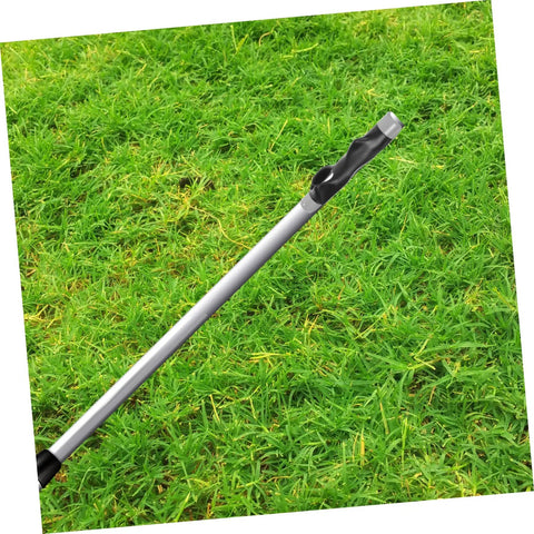 Golf Grip Trainer Pro Grade Swing Training Device on grassy field, lightweight and compact for consistent alignment practice.