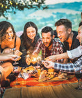 Group enjoying a picnic with Bright 1800 Lumen Go-To Camping Lantern With Four Lighting Modes for outdoor and survival use