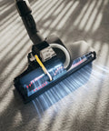 Turbo Floor Brush For Low To Medium Pile Carpets, Air Powered, gliding over carpet with nonstick hair and thread removal feature