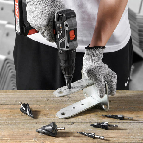 Worker using Workhorse M35 Step Drill Bit 1/8 To 1/2 Inch TiAlN Coated to drill metal bracket on wooden workbench.