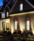 Low Voltage Outdoor Landscape Lights For Quick Safe Yard Vibes, 65.6Ft Wired LED Uplight Kit illuminating a brick house facade