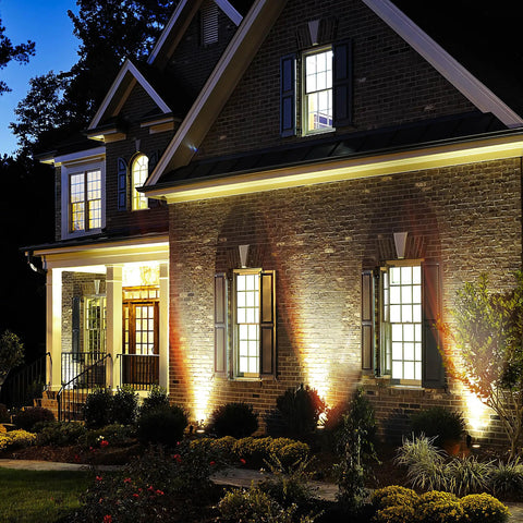 Low Voltage Outdoor Landscape Lights For Quick Safe Yard Vibes, 65.6Ft Wired LED Uplight Kit illuminating a brick house facade