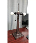 Base view of Mission Style Stained Glass Table Lamp, 23 Inch Tall, no shade, showing pull chains on a wooden desk.