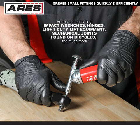 ARES 3-ounce push-type mini grease gun with needle nozzle, red handle, used with gloved hands