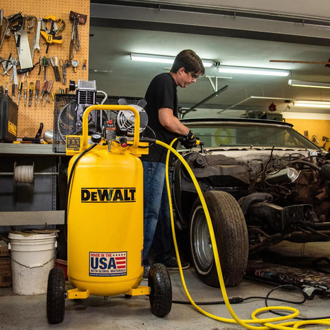 Heavy Duty 25 Gallon Vertical Air Compressor With 2 Hp Oil Lube Belt Drive Motor Portable Workshop Beast Pumping 200 Psi in a garage setup.