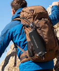 Hiker with backpack carrying 60W True Wireless Stereo Outdoor Speaker With IPX8 Waterproof Dual Pairing Bluetooth 5.4 Built In Mic